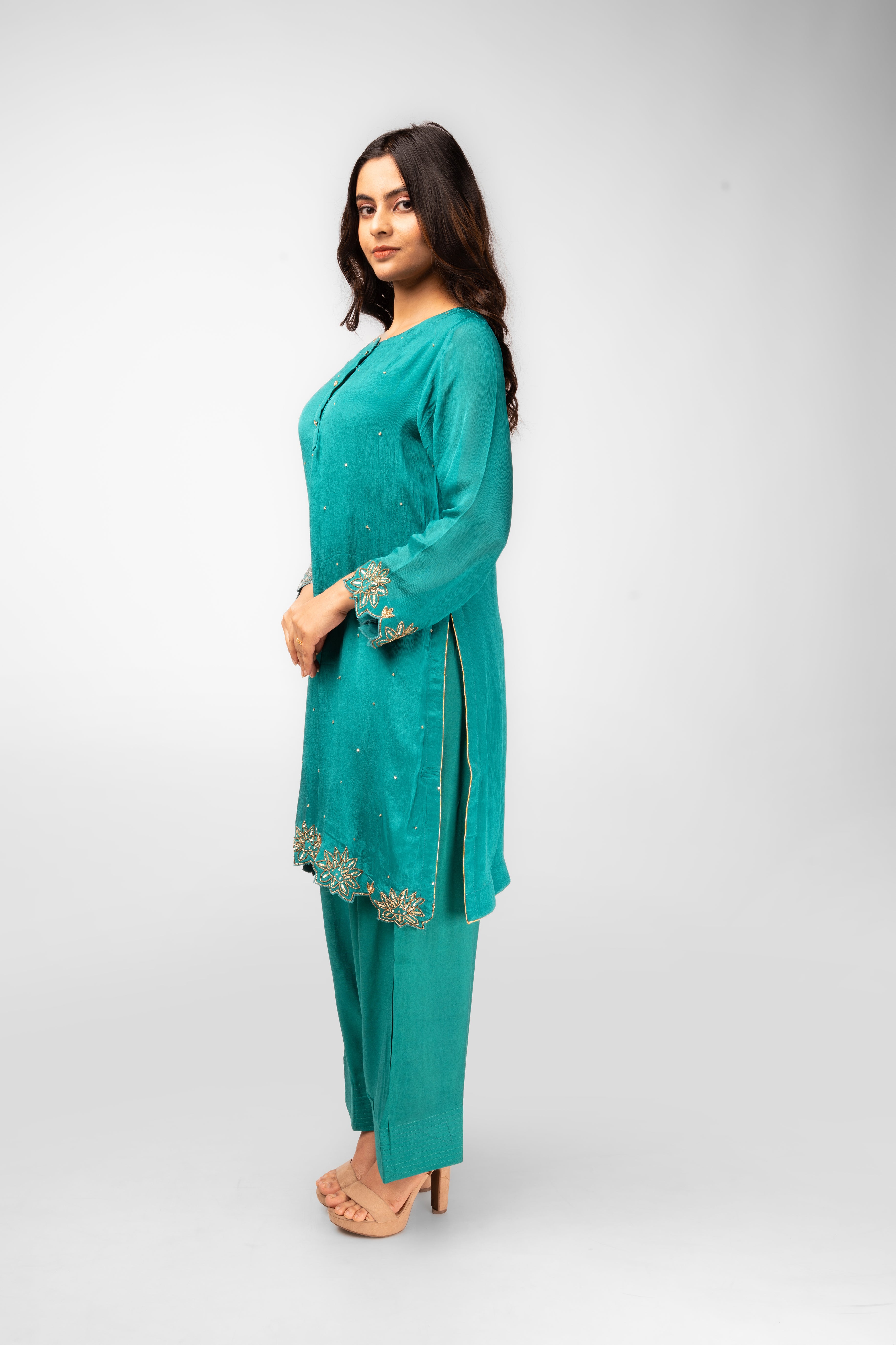 terquoise green co-ordset with stone buttons and farshi salwar