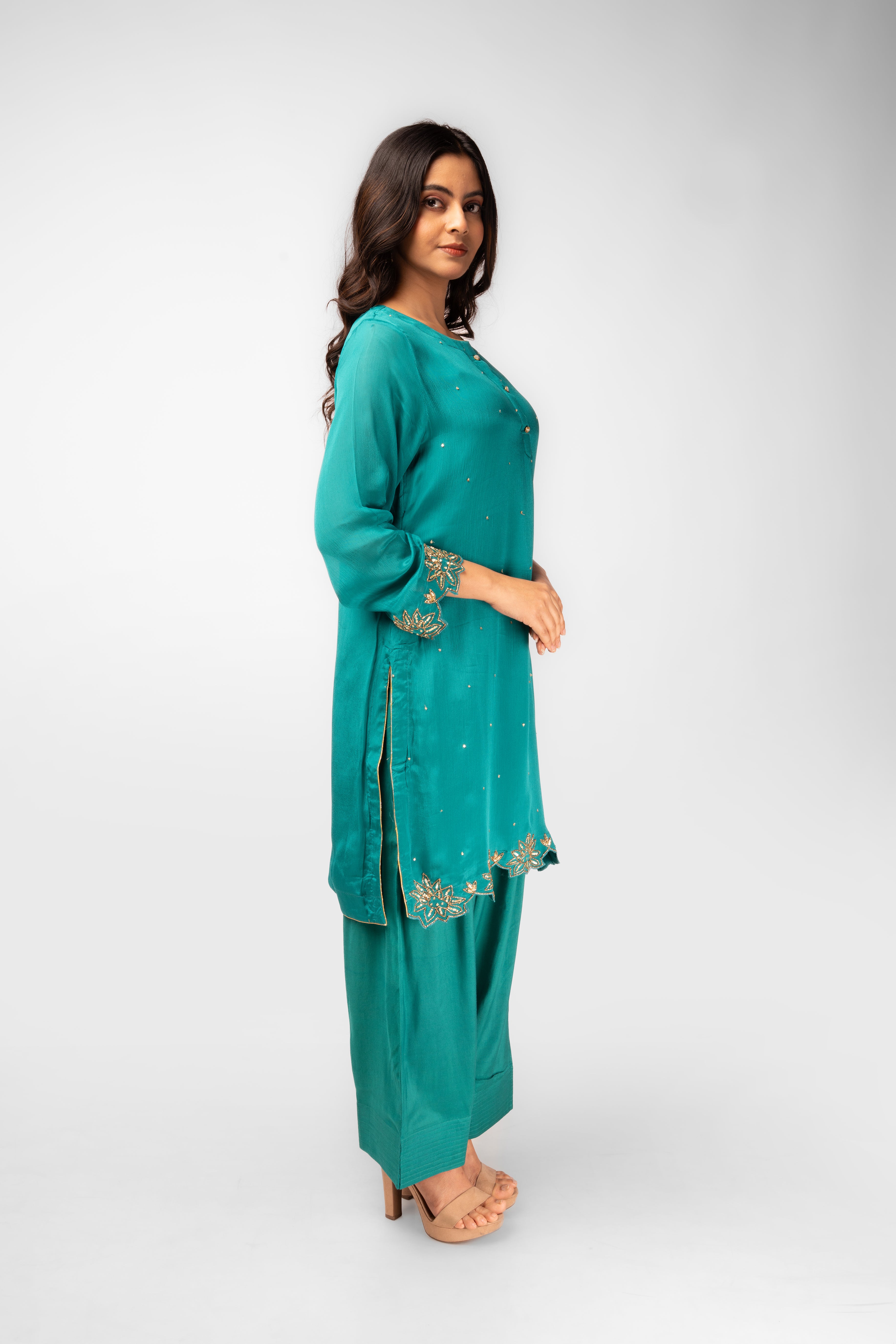 terquoise green co-ordset with stone buttons and farshi salwar