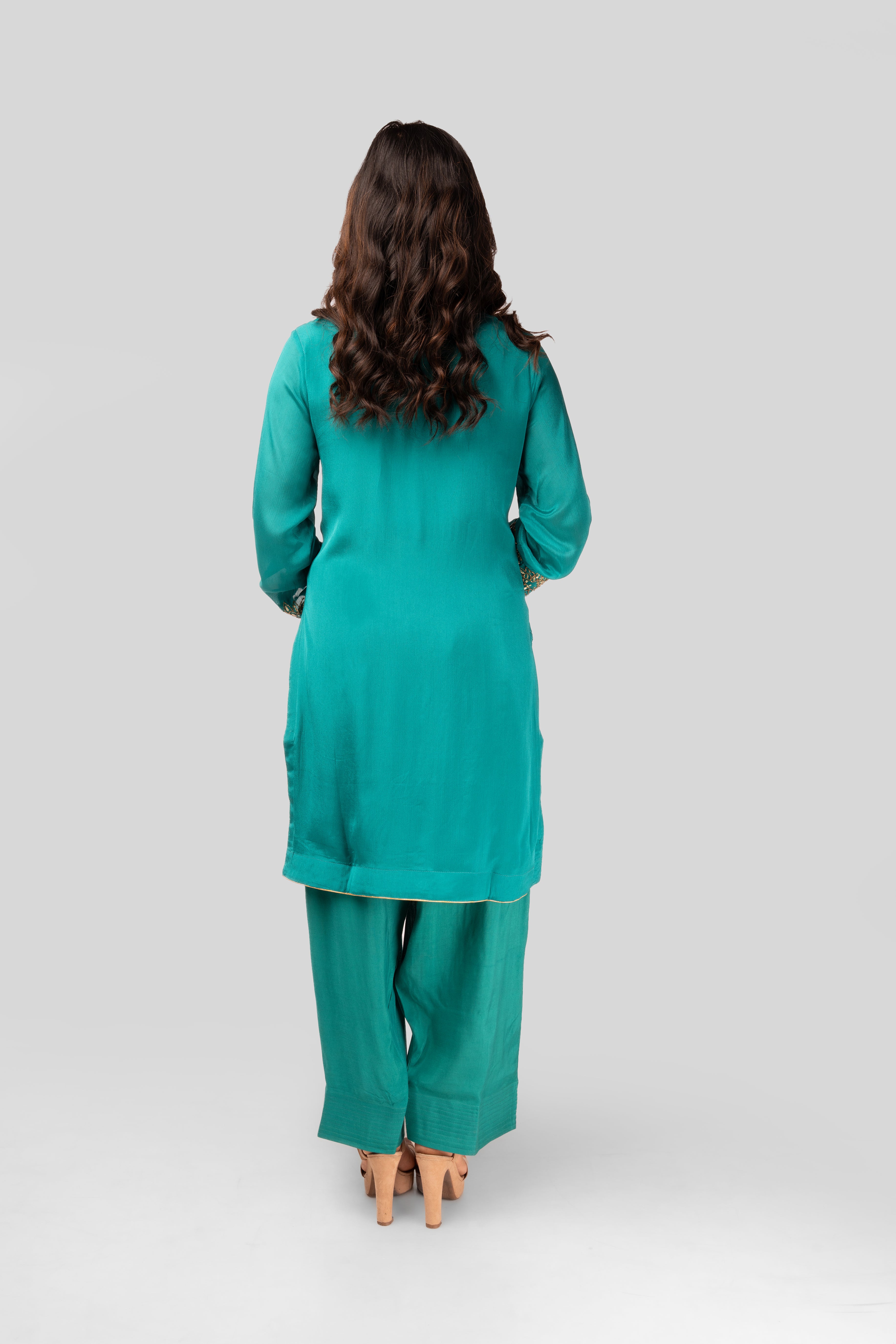 terquoise green co-ordset with stone buttons and farshi salwar