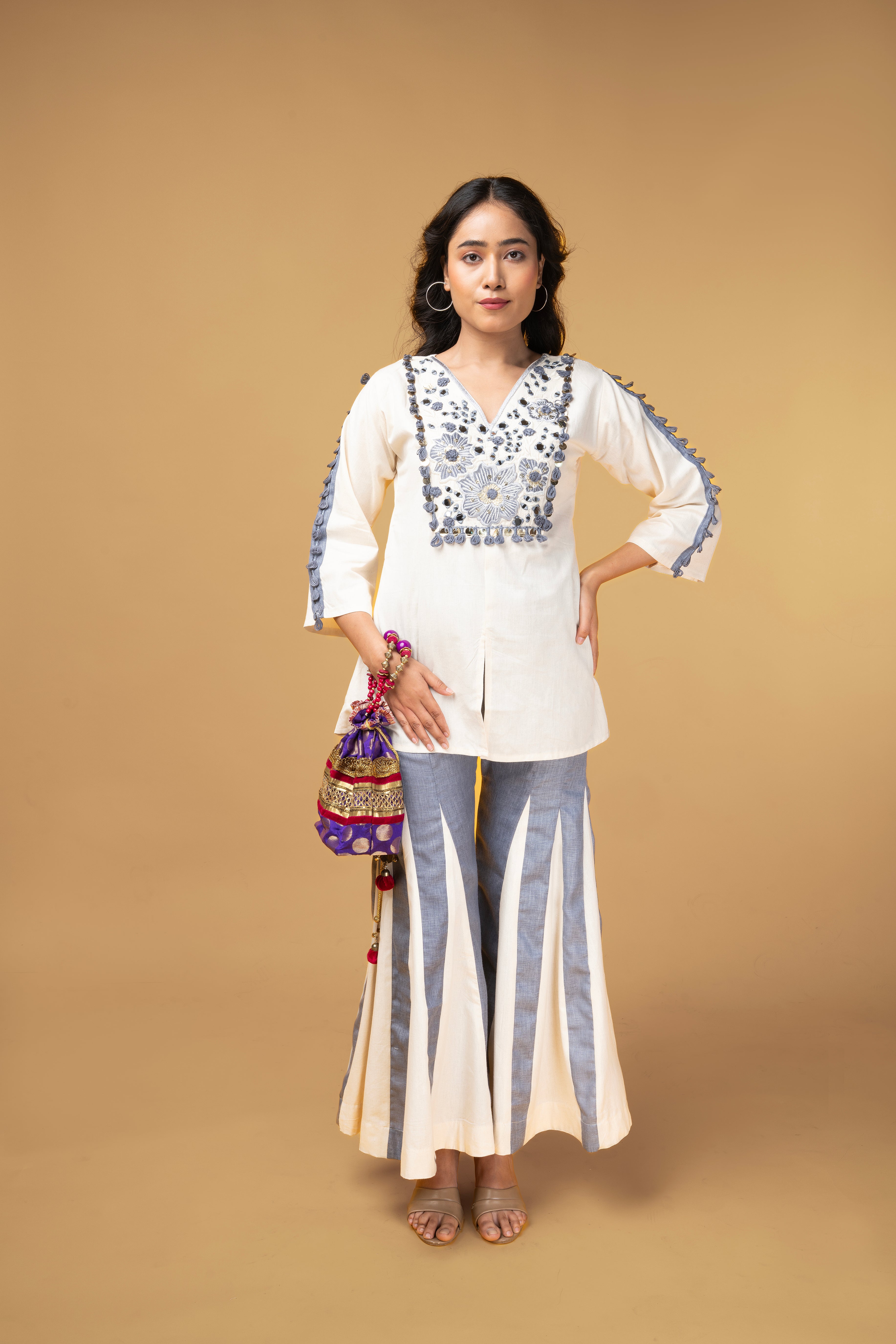 Offwhite and blue denim co-ordset with mirror handwork
