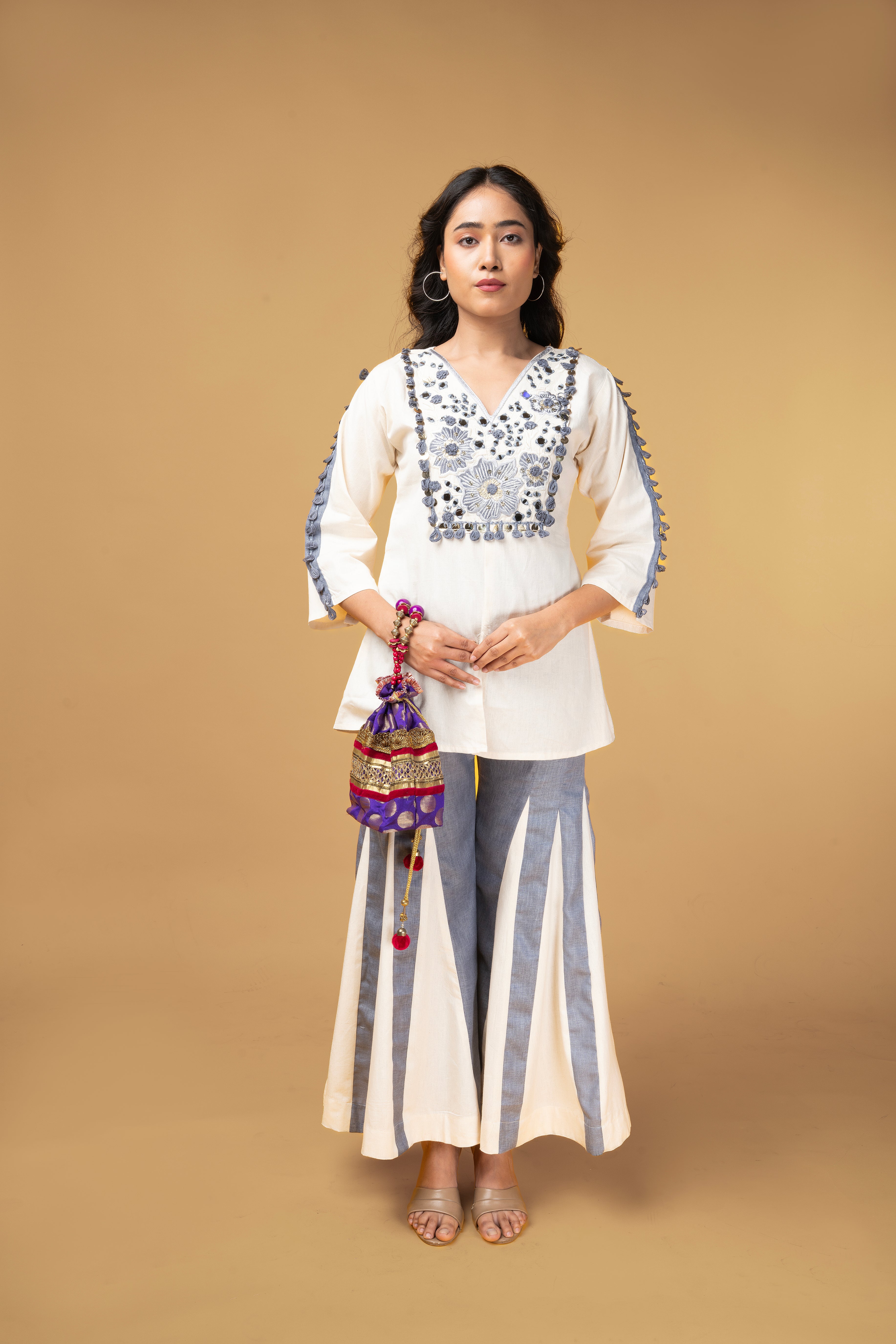 Offwhite and blue denim co-ordset with mirror handwork