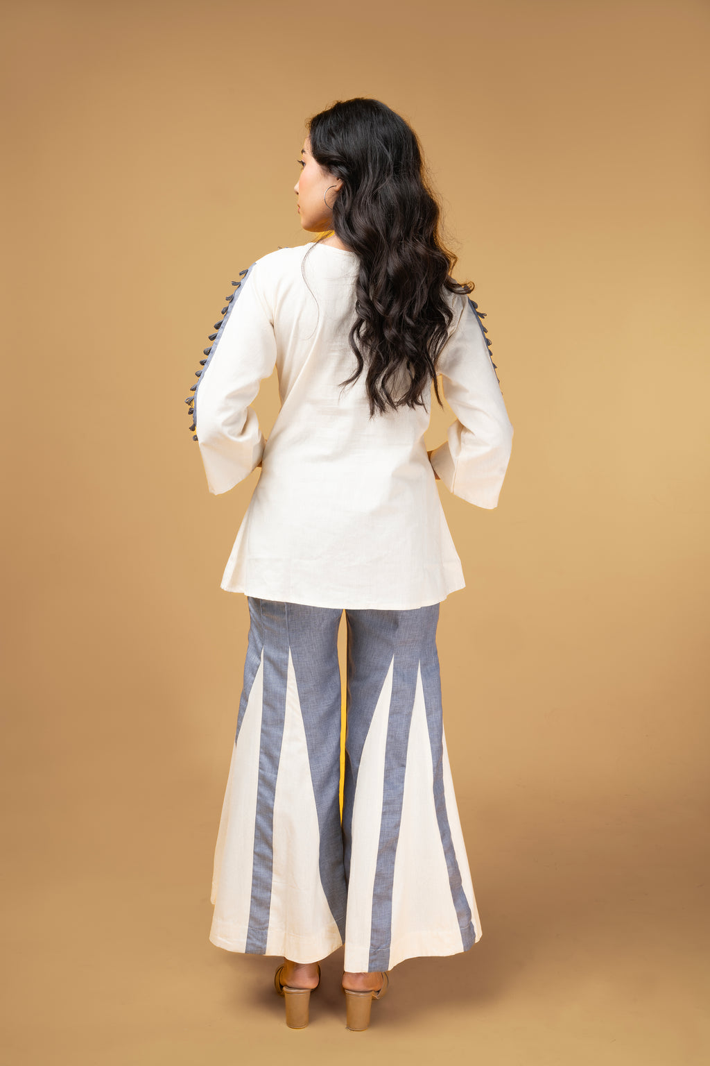 Offwhite and blue denim co-ordset with mirror handwork